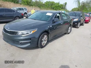 2016 Kia Optima LX with VIN KNAGT4L37G5073752, listed as a IAAI auction lot 42132621 with 136,818 mi miles. Bid and sale history available at carsss.com. Image 2.