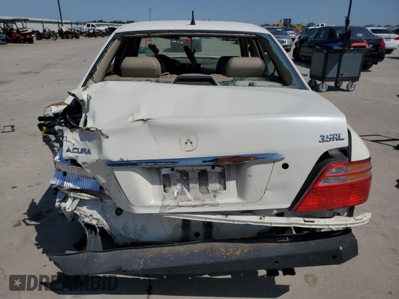 2002 Acura RL z VIN JH4KA96582C001815, wystawiony jako Copart lot #56925125 z przebiegiem Nie podano mil oraz Szkoda całkowita • Salvage title. Historia ofert i sprzedaży dostępna na DreamBid. Obrazek 6.