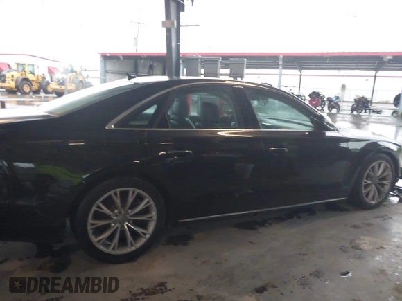 2012 Audi A8 with VIN WAUAVAFD9CN006499, listed as a IAAI auction lot 42461402 with 57,232 mi miles and . Bid and sale history available at DreamBid. Image 13.