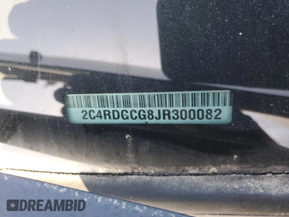 2018 Dodge Grand Caravan SXT with VIN 2C4RDGCG8JR300082, listed as a Copart auction lot 55357765 with 119,444 mi miles and Salvage Title. Bid and sale history available at DreamBid. Image 13.