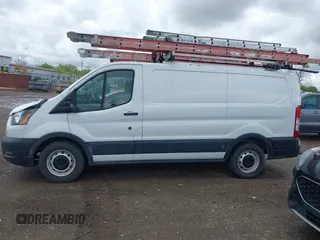 2021 Ford Transit Cargo z VIN 1FTYE1Y86MKA71783, wystawiony jako IAAI lot #42183454 z przebiegiem 53 405 mil mil oraz . Historia ofert i sprzedaży dostępna na DreamBid. Obrazek 14.