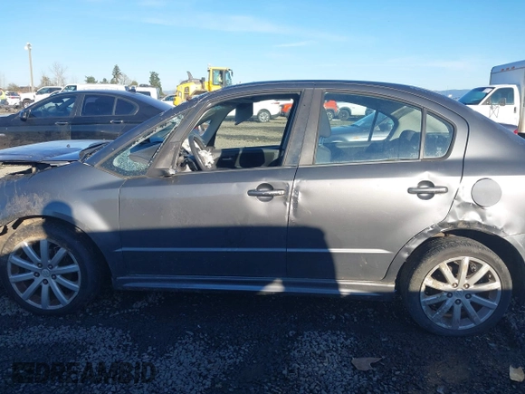 2010 Suzuki SX4 with VIN JS2YC5A40A6300053, listed as a IAAI auction lot 41392061 with 114,863 mi miles and . Bid and sale history available at DreamBid. Image 14.