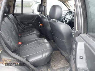 2002 Jeep Grand Cherokee with VIN 1J4GW38N62C190851, listed as a IAAI auction lot 42519384 with 142,066 mi miles and . Bid and sale history available at DreamBid. Image 8.