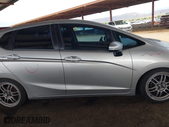 2015 Honda Fit LX with VIN 3HGGK5G52FM764205, listed as a IAAI auction lot 42641420 with 104,783 mi miles and . Bid and sale history available at DreamBid. Image 14.