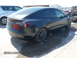 2022 Tesla Model 3 Performance with VIN 5YJ3E1EC6NF104475, listed as a IAAI auction lot 41734724 with 31,717 mi miles and . Bid and sale history available at carsss.com. Image 4.