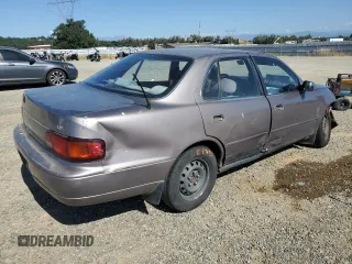 1996 Toyota Camry DX z VIN JT2BG12K7T0419839, wystawiony jako Copart lot #58267425 z przebiegiem 215 456 mil mil oraz Szkoda całkowita • Salvage title. Historia ofert i sprzedaży dostępna na DreamBid. Obrazek 3.