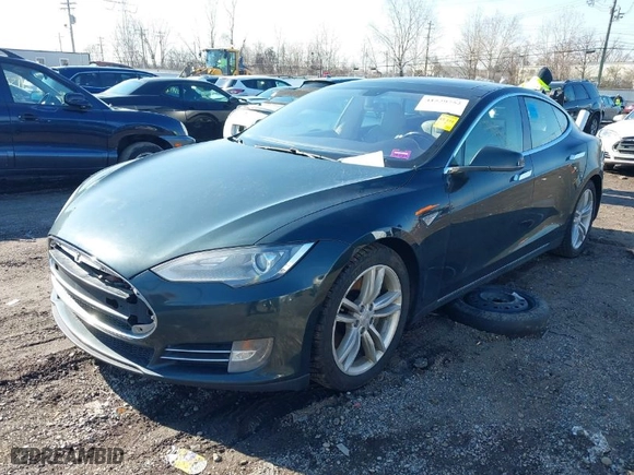 2013 Tesla Model S with VIN 5YJSA1CN7DFP26335, listed as a IAAI auction lot 41529752 with 247,789 mi miles. Bid and sale history available at carsss.com. Image 2.