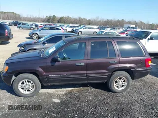 2004 Jeep Grand Cherokee with VIN 1J8GX48S24C266933, listed as a IAAI auction lot 41497122 with 200,899 mi miles and . Bid and sale history available at DreamBid. Image 14.