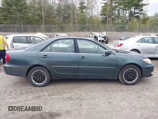 2003 Toyota Camry LE z VIN 4T1BE30K13U746690, wystawiony jako IAAI lot #42220794 z przebiegiem 165 807 mil mil oraz . Historia ofert i sprzedaży dostępna na DreamBid. Obrazek 13.