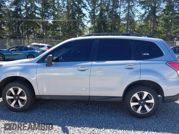 2018 Subaru Forester with VIN JF2SJABC1JH460789, listed as a IAAI auction lot 42631854 with 86,215 mi miles and . Bid and sale history available at DreamBid. Image 15.