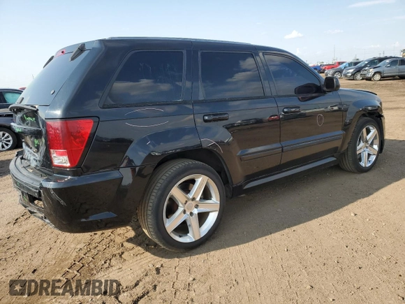 2008 Jeep Grand Cherokee SRT-8 with VIN 1J8HR78308C174606, listed as a Copart auction lot 70313584 with 169,765 mi miles and Salvage Title. Bid and sale history available at carsss.com. Image 3.