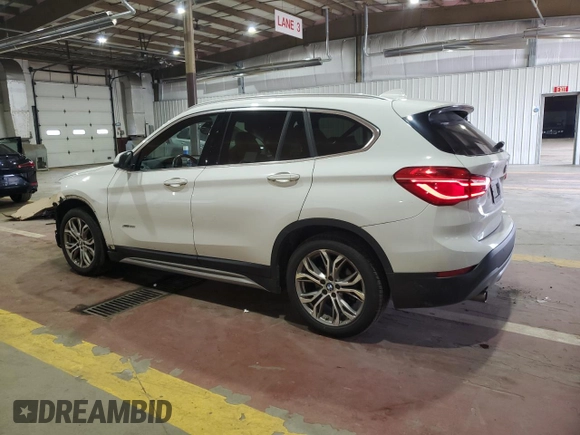 2017 BMW X1 xDrive28i with VIN WBXHT3Z34H4A54811, listed as a Copart auction lot 63584405 with 92,699 mi miles and Salvage title. Bid and sale history available at DreamBid. Image 2.