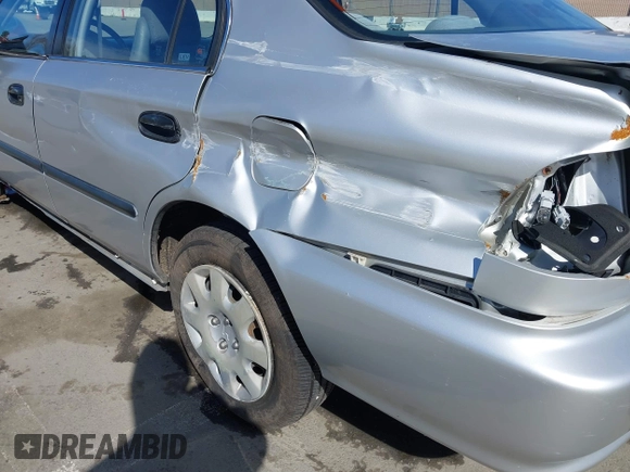 1999 Honda Civic LX with VIN JHMEJ6670XS000958, listed as a IAAI auction lot 41620949 with 93,698 mi miles and . Bid and sale history available at DreamBid. Image 6.