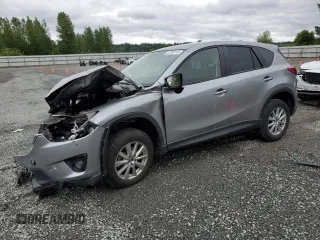 2014 Mazda CX-5 Touring z VIN JM3KE4CYXE0426408, wystawiony jako Copart lot #57355115 z przebiegiem Nie podano mil oraz Szkody całkowita. Historia ofert i sprzedaży dostępna na DreamBid. Obrazek 1.