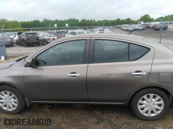 2015 Nissan Versa SV with VIN 3N1CN7AP7FL869485, listed as a IAAI auction lot 42077524 with 198,646 mi miles. Bid and sale history available at carsss.com. Image 14.