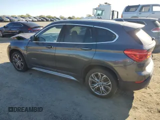 2017 BMW X1 sDrive28i with VIN WBXHU7C3XH5H36874, listed as a Copart auction lot 50607235 with 100,458 mi miles and Clean Title. Bid and sale history available at carsss.com. Image 2.