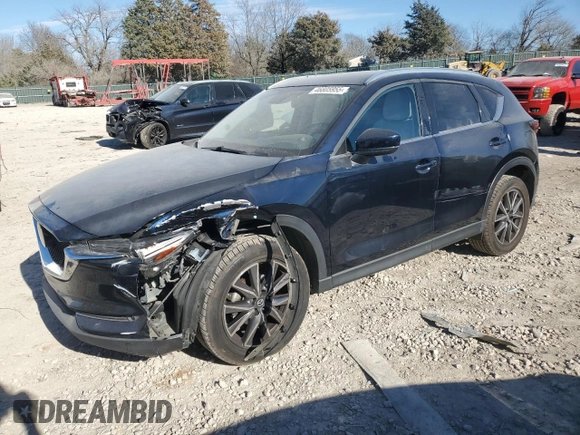 2018 Mazda CX-5 Grand Touring with VIN JM3KFADM4J1341740, listed as a Copart auction lot 46805955 with 99,114 mi miles and Salvage Title. Bid and sale history available at DreamBid. Image 1.