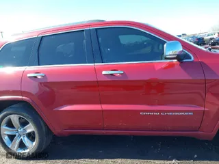 2014 Jeep Grand Cherokee Overland with VIN 1C4RJFCG2EC216406, listed as a IAAI auction lot 41944794 with 124,007 mi miles. Bid and sale history available at carsss.com. Image 13.