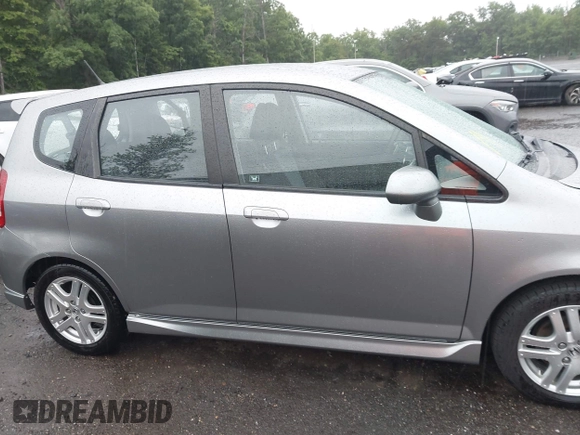 2007 Honda Fit Sport z VIN JHMGD38647S049521, wystawiony jako IAAI lot #42289057 z przebiegiem 130 434 mil mil oraz . Historia ofert i sprzedaży dostępna na DreamBid. Obrazek 13.