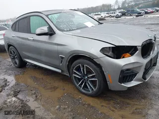 2021 BMW X4 M with VIN 5YMUJ0C01M9F26207, listed as a IAAI auction lot 41502307 with 31,995 mi miles. Bid and sale history available at carsss.com. Image 1.