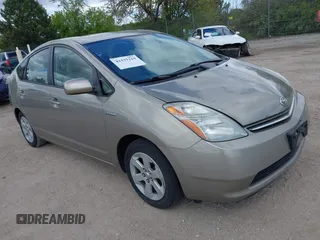 2007 Toyota Prius z VIN JTDKB20U573212497, wystawiony jako IAAI lot #42337219 z przebiegiem 198 984 mil mil oraz . Historia ofert i sprzedaży dostępna na DreamBid. Obrazek 1.