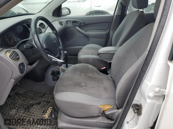 2004 Ford Focus with VIN 3FAFP37Z94R101447, listed as a Copart auction lot 74570054 with 162,166 mi miles and Salvage title. Bid and sale history available at DreamBid. Image 7.