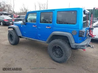 2016 Jeep Wrangler Unlimited Rubicon with VIN 1C4BJWFG2GL192074, listed as a IAAI auction lot 41598861 with 70,000 mi miles. Bid and sale history available at carsss.com. Image 3.
