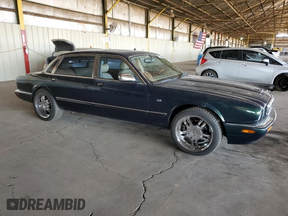 1999 Jaguar XJ with VIN SAJKX6046XC855872, listed as a Copart auction lot 47060465 with 65,286 mi miles and Clean title. Bid and sale history available at DreamBid. Image 4.