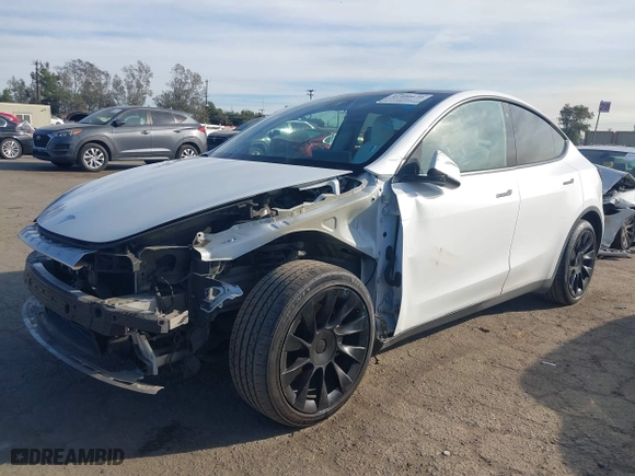 2023 Tesla Model Y Long Range with VIN 7SAYGDEE0PF631811, listed as a IAAI auction lot 41400620 with 81,358 mi miles. Bid and sale history available at carsss.com. Image 20.