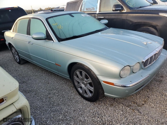 2005 Jaguar XJ with VIN SAJWA79C05SG37189, listed as a Copart auction lot 76804104 with 0 mi miles and Salvage Title. Bid and sale history available at carsss.com. Image 4.
