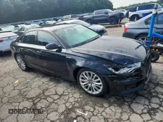 2014 Audi A6 Prestige with VIN WAUHGAFCXEN008586, listed as a Copart auction lot 60304815 with 133,577 mi miles and Salvage title. Bid and sale history available at DreamBid. Image 4.