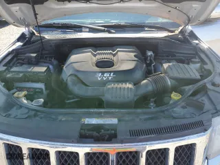 2012 Jeep Grand Cherokee Overland with VIN 1C4RJFCG5CC272580, listed as a Copart auction lot 50075735 with 209,368 mi miles and Salvage Title. Bid and sale history available at carsss.com. Image 12.