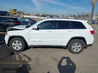 2014 Jeep Grand Cherokee Laredo with VIN 1C4RJEAGXEC130399, listed as a IAAI auction lot 41861664 with 106,925 mi miles. Bid and sale history available at carsss.com. Image 14.