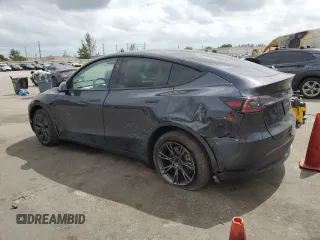 2025 Tesla Model Y Long Range with VIN 7SAYGDED6SF228626, listed as a Copart auction lot 47654525 with 2,087 mi miles and Salvage Title. Bid and sale history available at DreamBid. Image 2.