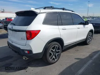 2023 Honda Passport Elite with VIN 5FNYF8H07PB010220, listed as a IAAI auction lot 41675730 with 25,128 mi miles and . Bid and sale history available at DreamBid. Image 4.