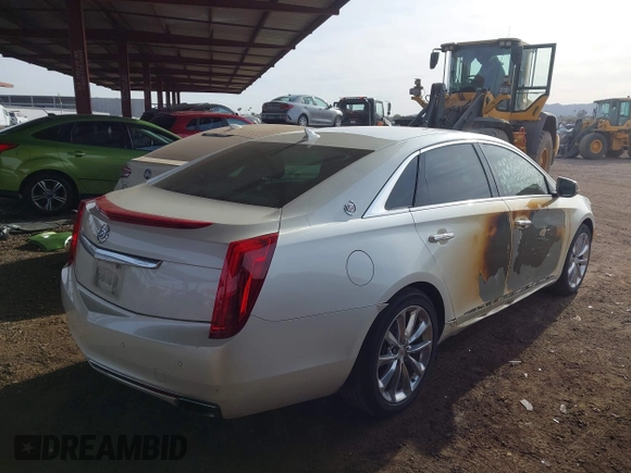 2014 Cadillac XTS Luxury with VIN 2G61M5S35E9199253, listed as a IAAI auction lot 41400558 with 112,955 mi miles. Bid and sale history available at carsss.com. Image 4.