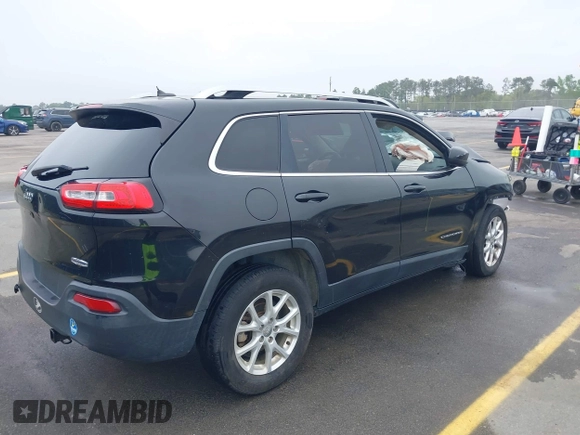 2015 Jeep Cherokee Latitude with VIN 1C4PJLCB9FW737360, listed as a IAAI auction lot 41939681 with 226,603 mi miles and . Bid and sale history available at carsss.com. Image 4.