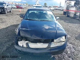 2000 Mazda 626 LX with VIN 1YVGF22CXY5123930, listed as a IAAI auction lot 40712369 with 210,234 mi miles. Bid and sale history available at carsss.com. Image 12.