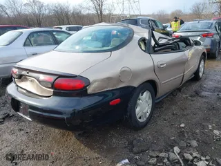 1999 Ford Taurus SE with VIN 1FAFP53U3XA131984, listed as a IAAI auction lot 41638566 with 84,836 mi miles. Bid and sale history available at carsss.com. Image 4.