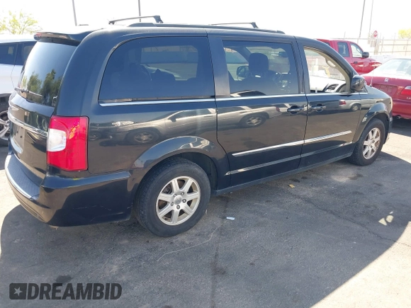 2011 Chrysler Town & Country Touring with VIN 2A4RR5DG2BR702731, listed as a IAAI auction lot 42095661 with 202,968 mi miles and . Bid and sale history available at DreamBid. Image 4.