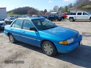 1994 Ford Escort z VIN 3FARP13J8RR100153, wystawiony jako IAAI lot #41934023 z przebiegiem 600 704 mil mil oraz . Historia ofert i sprzedaży dostępna na DreamBid. Obrazek 1.
