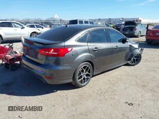 2016 Ford Focus SE with VIN 1FADP3F21GL262907, listed as a IAAI auction lot 41657582 with 62,789 mi miles. Bid and sale history available at carsss.com. Image 4.