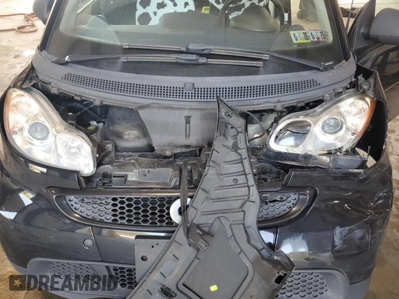 2015 Smart fortwo Passion с VIN WMEEJ3BA6FK820446, выставлен на аукционе Copart как лот 63243635 с пробегом Не указан миль и Списание • Salvage title. История ставок и продаж доступна на DreamBid. Изображение 11.