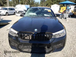 2018 BMW M5 z VIN WBSJF0C57JB283361, wystawiony jako Copart lot #65352164 z przebiegiem Nie podano mil oraz Szkoda całkowita • Salvage title. Historia ofert i sprzedaży dostępna na DreamBid. Obrazek 5.