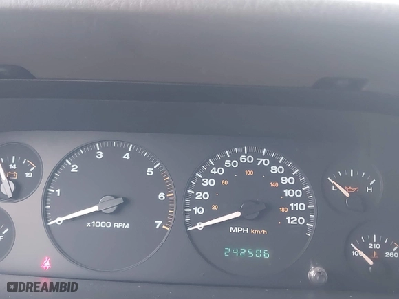 2004 Jeep Grand Cherokee Laredo with VIN 1J4GX48S14C177923, listed as a IAAI auction lot 41745772 with 242,506 mi miles. Bid and sale history available at carsss.com. Image 7.