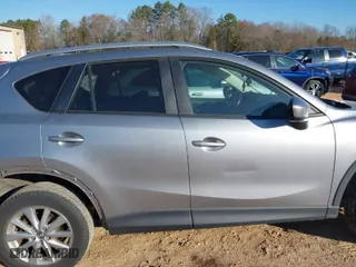2014 Mazda CX-5 Touring with VIN JM3KE2CY2E0423376, listed as a IAAI auction lot 41650933 with 113,352 mi miles. Bid and sale history available at carsss.com. Image 13.