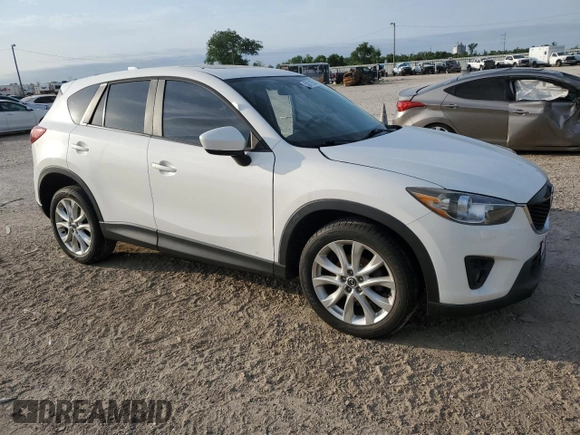 2014 Mazda CX-5 Grand Touring with VIN JM3KE4DYXE0377810, listed as a Copart auction lot 53071255 with 117,642 mi miles and Salvage Title. Bid and sale history available at DreamBid. Image 4.