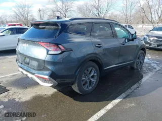 2023 Kia Sportage Hybrid SX-Prestige with VIN KNDPXCAG5P7038476, listed as a IAAI auction lot 41532005 with 14,151 mi miles. Bid and sale history available at carsss.com. Image 4.