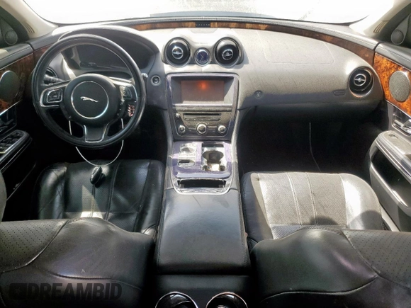 2012 Jaguar XJ with VIN SAJWA1CB0CLV23002, listed as a Copart auction lot 52804915 with 149,331 mi miles and Salvage title. Bid and sale history available at DreamBid. Image 8.