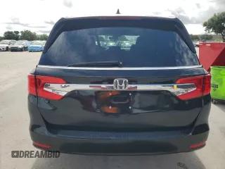 2018 Honda Odyssey EX-L z VIN 5FNRL6H7XJB031245, wystawiony jako Copart lot #59331635 z przebiegiem 74 901 mil mil oraz Czysty tytuł • Clean title. Historia ofert i sprzedaży dostępna na DreamBid. Obrazek 6.